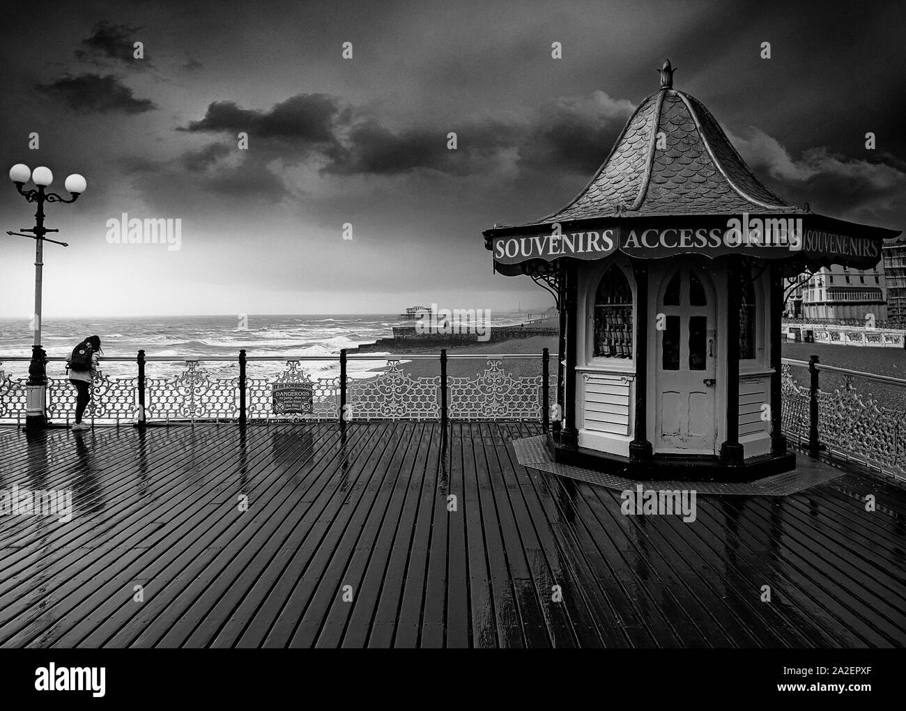 A wind and rain-swept kiosk on Brighton Palace Pier, opened in 1899 in Brighton, Sussex, England. Stock Photo