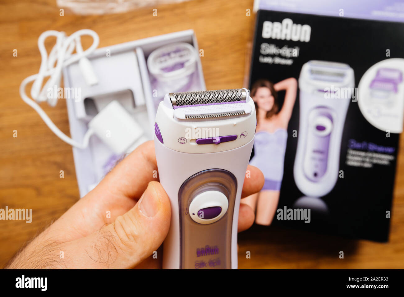Paris, France - Sep 23, 2019: POV man hand unboxing new Braun Silk Epil  women lady shaver epilator 3 in 1 trimmer, exfoliation system for smooth  and radiant skin - wooden table background Stock Photo - Alamy