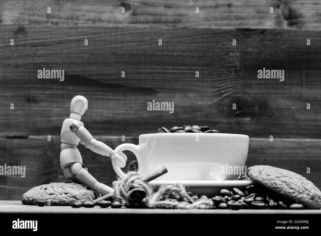 Cup full coffee brown roasted bean blue wooden background. Fresh