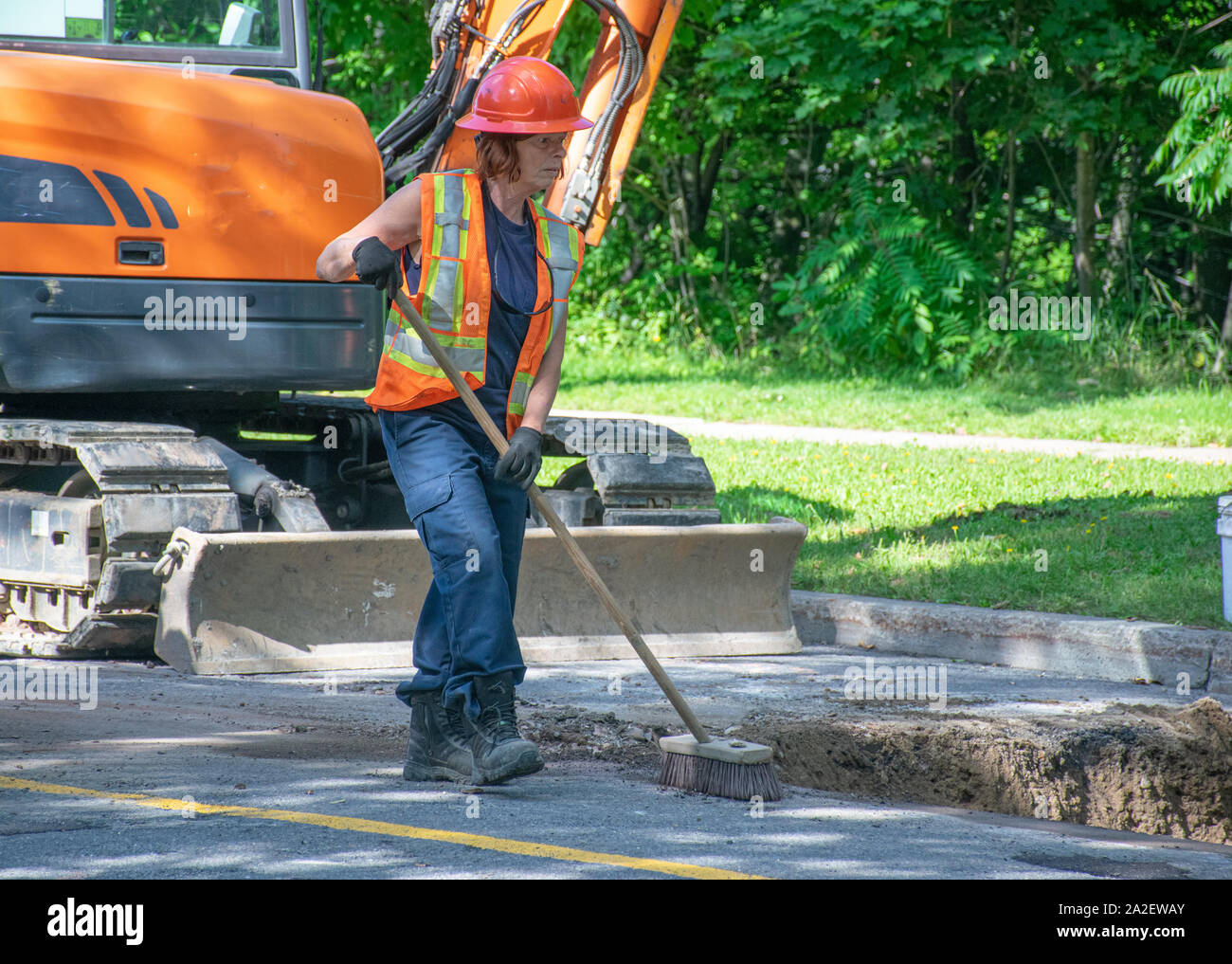 women working on roadway Stock Photo