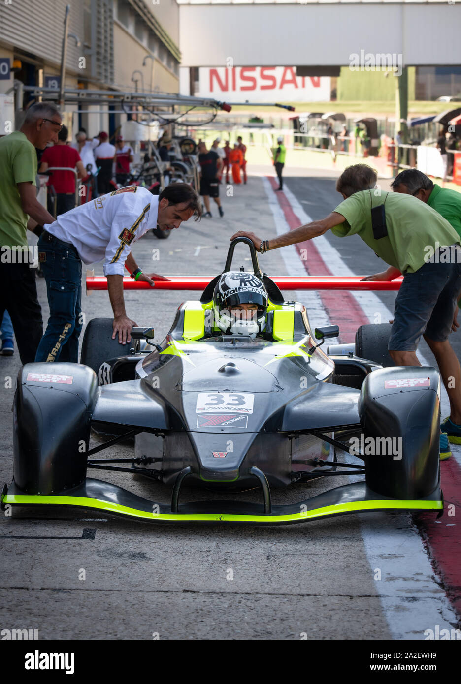 Vallelunga, Italy september 14 2019.  Single seater prototype racing car in circuit pit lane with team people working Stock Photo