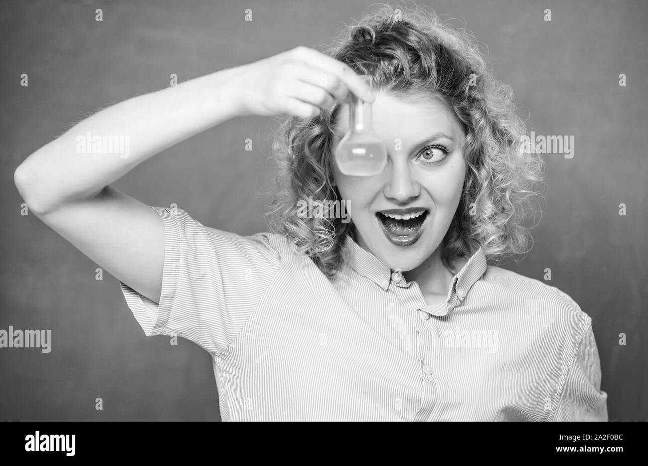 Science and education. girl hold chemical flask with liquid. happy student with beaker. biology experiment. sample formula. chemistry research results Stock Photo