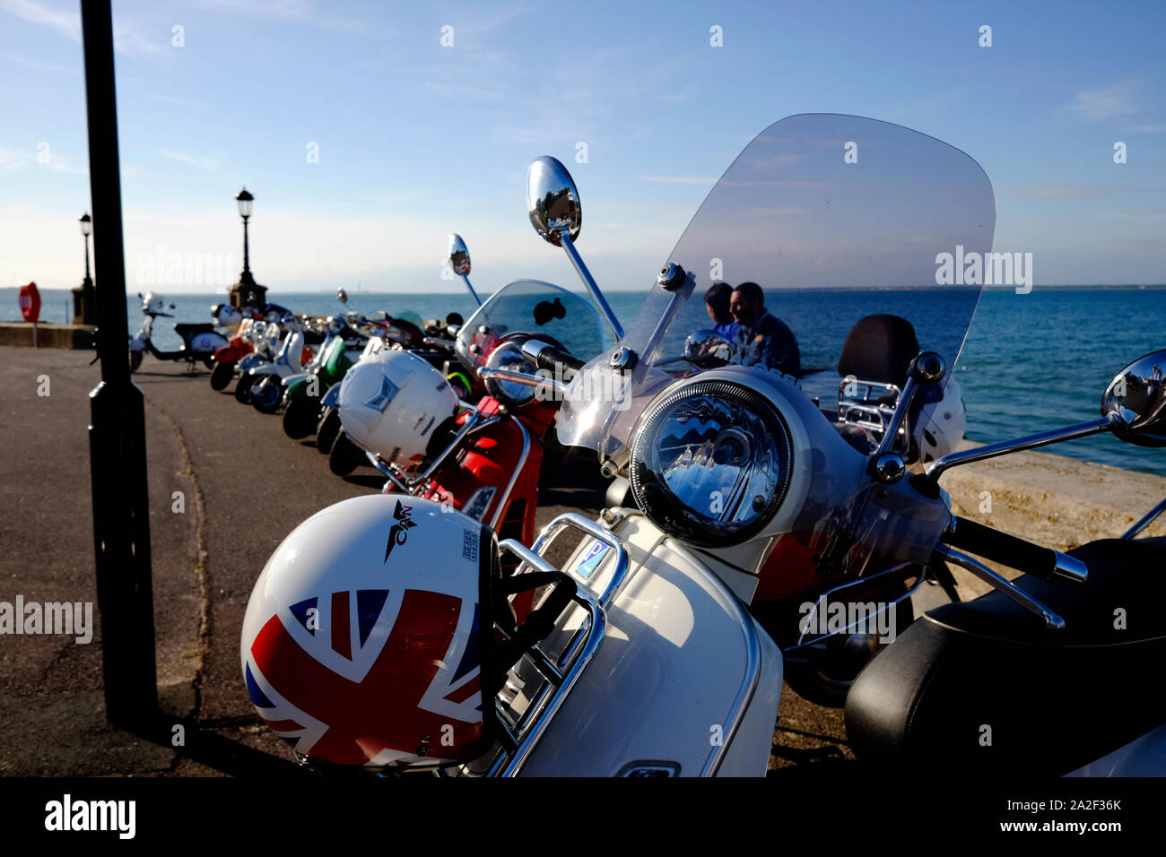 Moped scooters lined up parked on the seafront at Ryde on the Isle of
