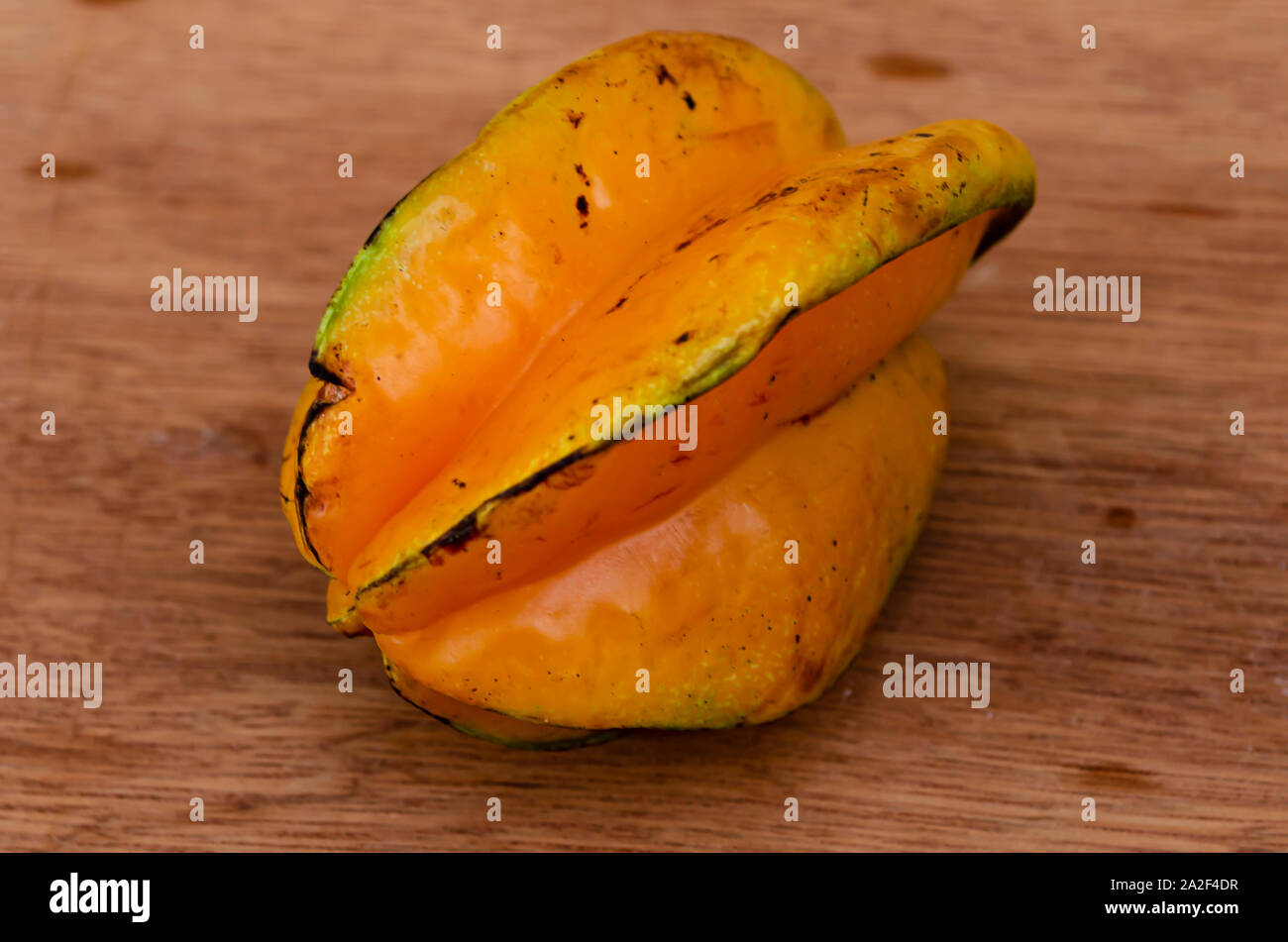 Very Ripe Star Fruit On Board Table Stock Photo - Alamy