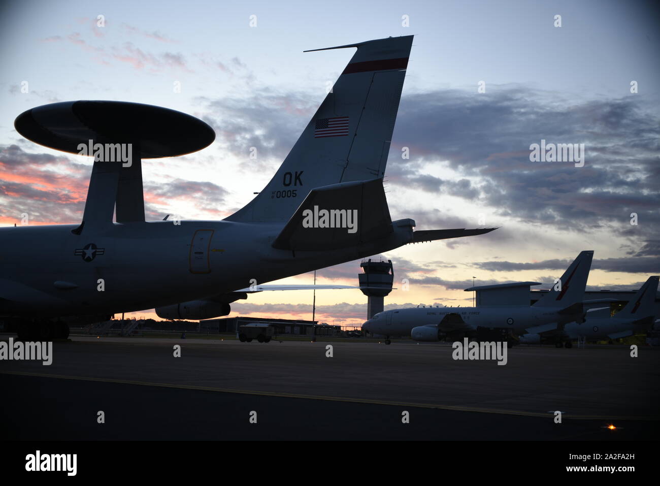 An E-3G Airborne Warning and Control System aircraft of the 552nd Air Control Wing, 960th Airborne Air Control Squadron, joins the Royal Australian Air Force E-7A Airborne Early Warning and Control aircraft in September 2019, Williamtown, Australia. The AWACS joined the RAAF to work on mission integration and partnership of similar airframes in response to the E-7A AEWC visiting the 552nd ACW in 2017. (U.S. Air Force photo/2d Lt Ashlyn K. Paulson) Stock Photo