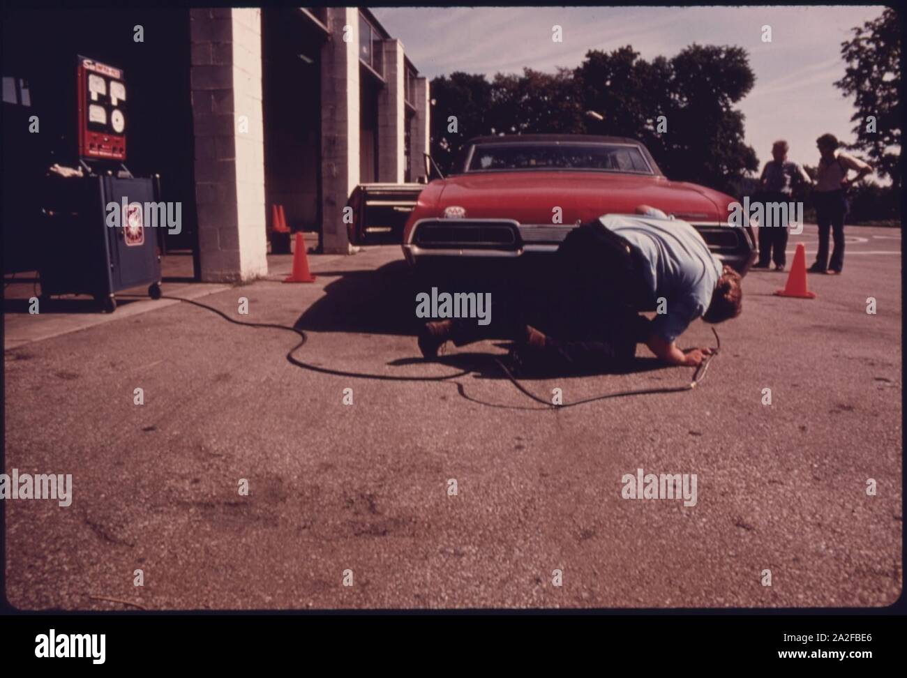 Employee at the Hamilton County Auto Emission Inspection Station at Newtown, Ohio...081975