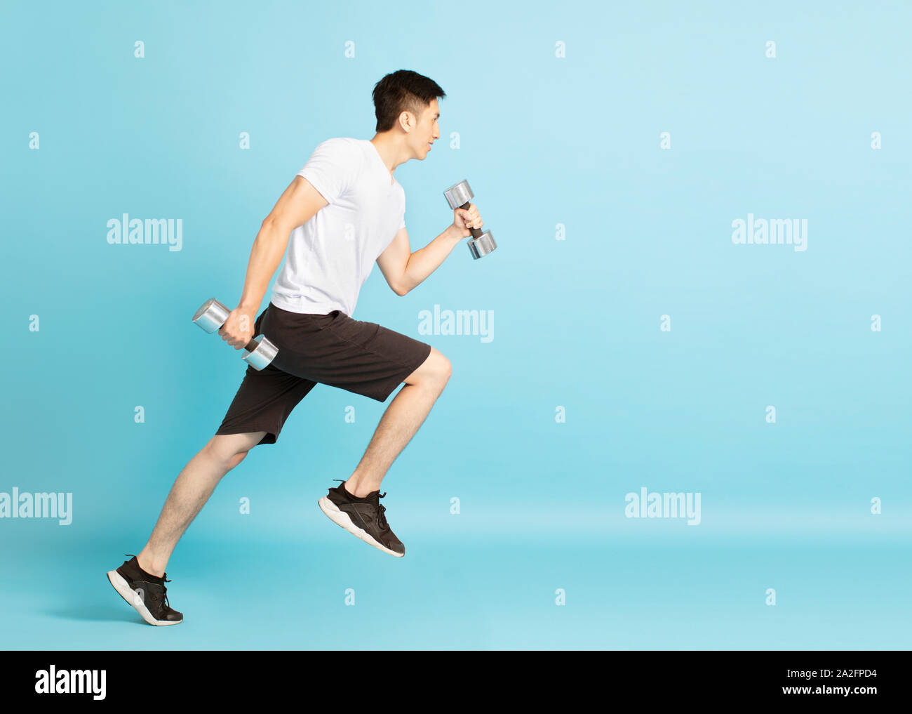 Full length portrait of young fitness man running Stock Photo
