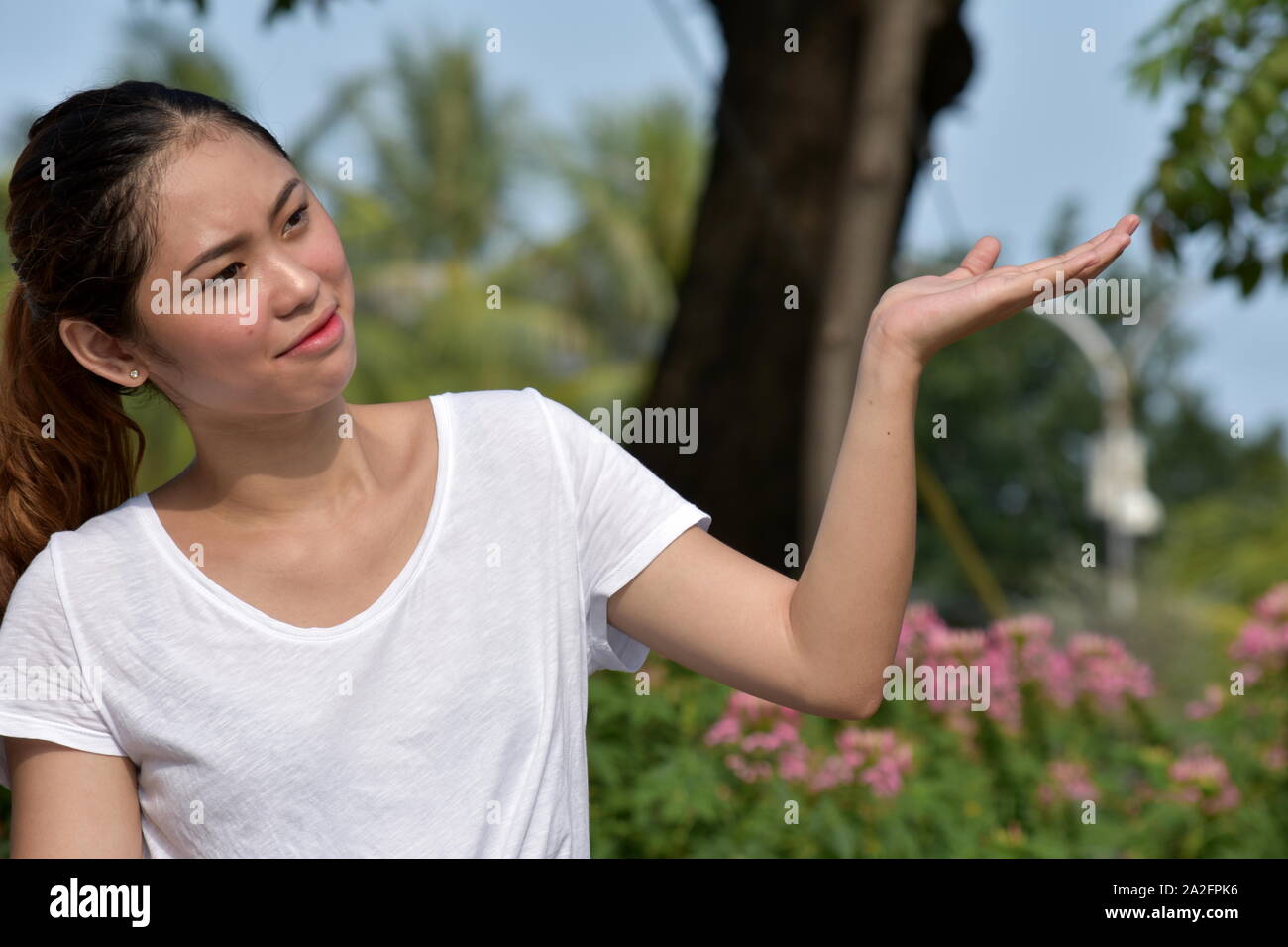An Undecided Young Female Stock Photo