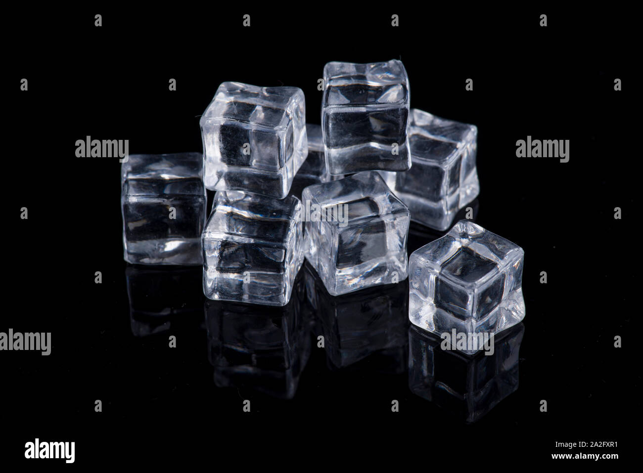 Fake ice cube isolated on black background Stock Photo Alamy