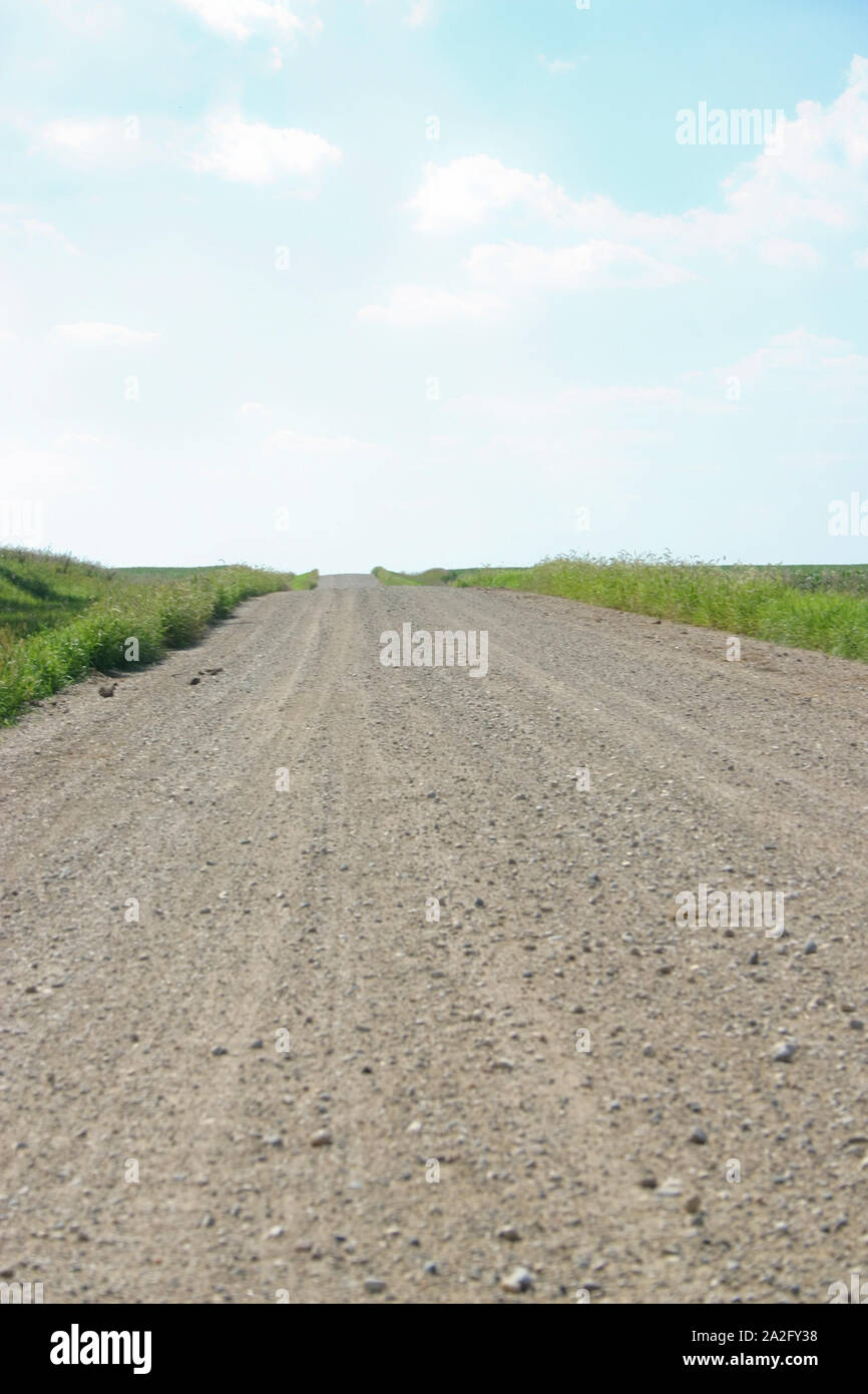 An empty, deserted gravel road in the Minnesota countryside. Stock Photo