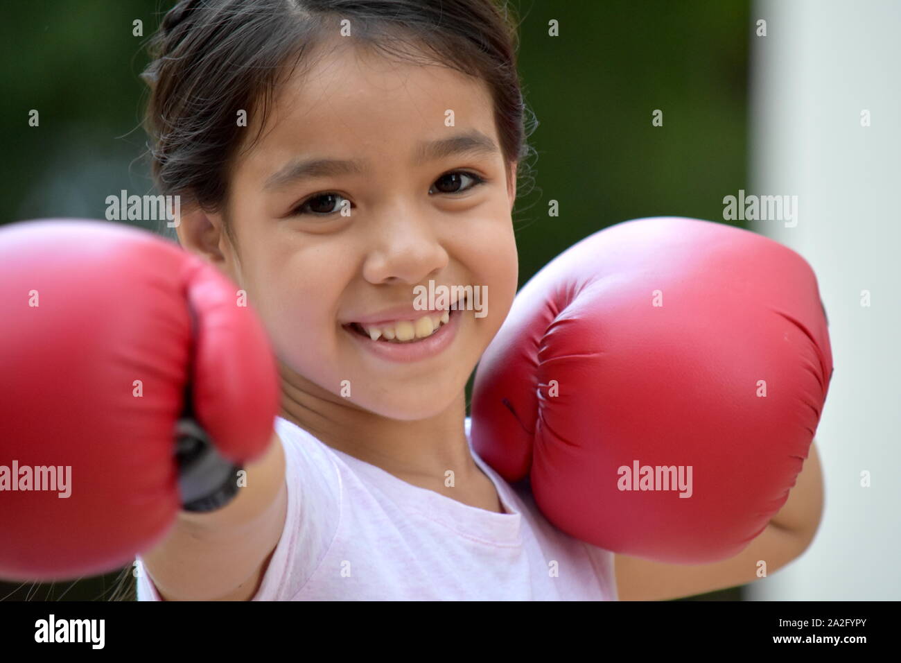 Happy Child Athlete Wearing Boxing Gloves Stock Photo