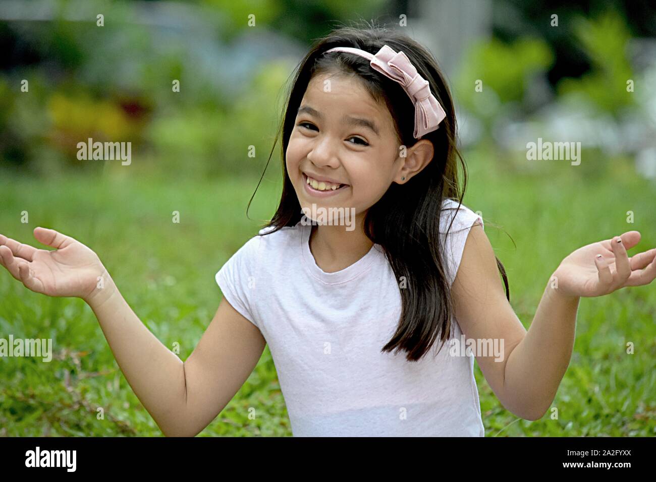 A Petite Asian Girl And Indecisiveness Stock Photo