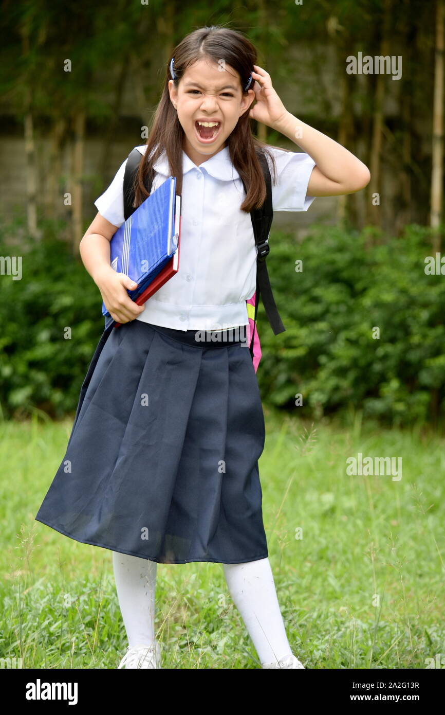 filipina school girls Young Filipina School Girl And Anxiety Wearing School Uniform Stock Photo -  Alamy