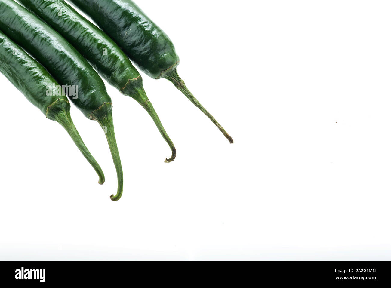 Green chilli peppers isolated on white background Stock Photo - Alamy