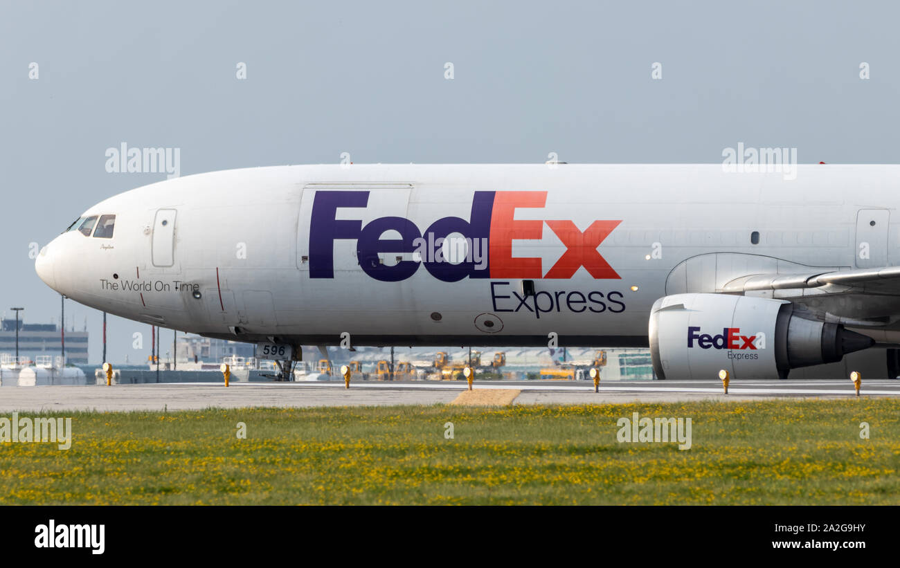 FedEx Express MD-11F (N596FE) leaving the runway after landing at Toronto Pearson Intl. Airport. Stock Photo