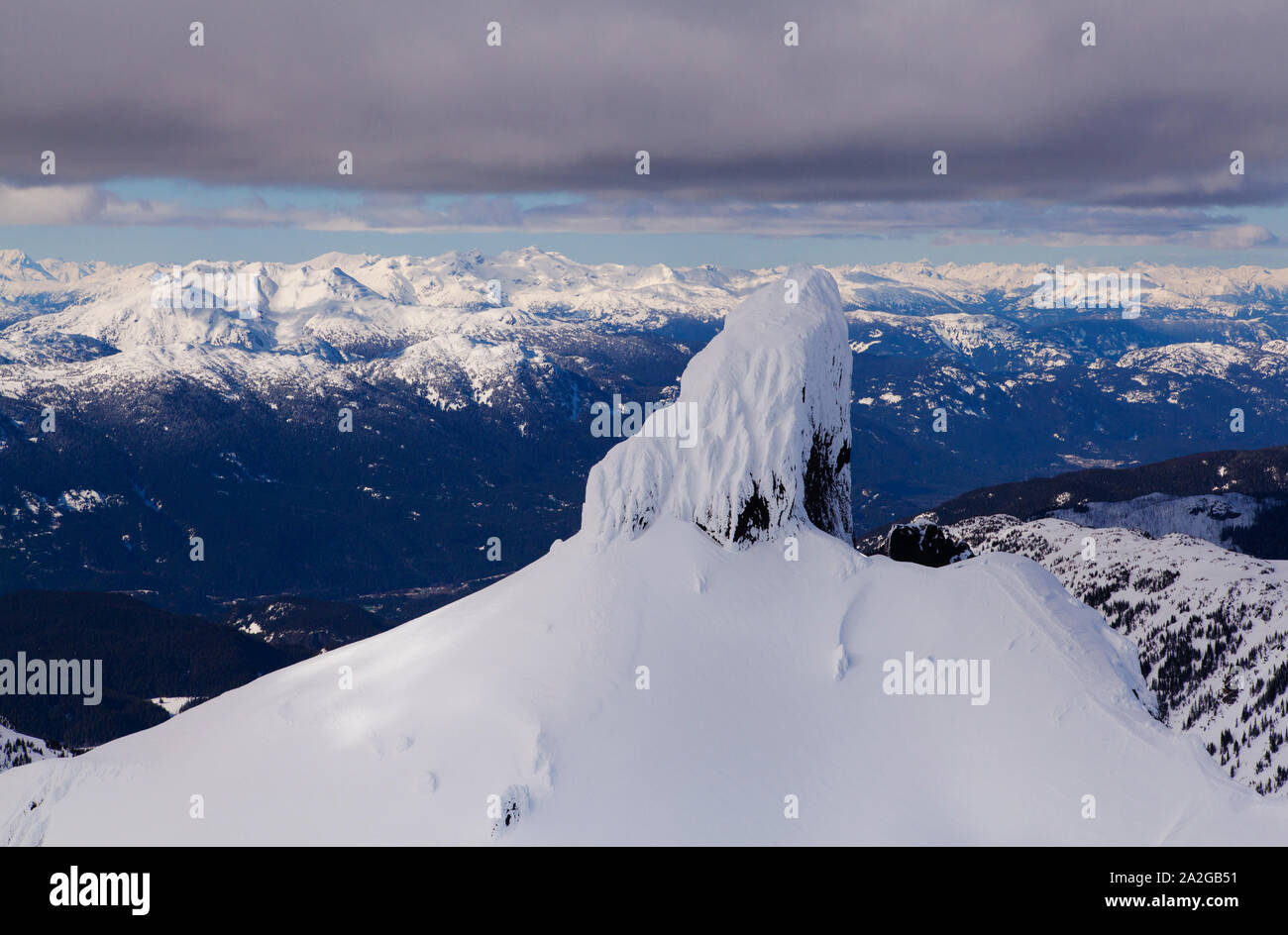 Aerial of Black Tusk in the snow near Whistler, BC. Stock Photo
