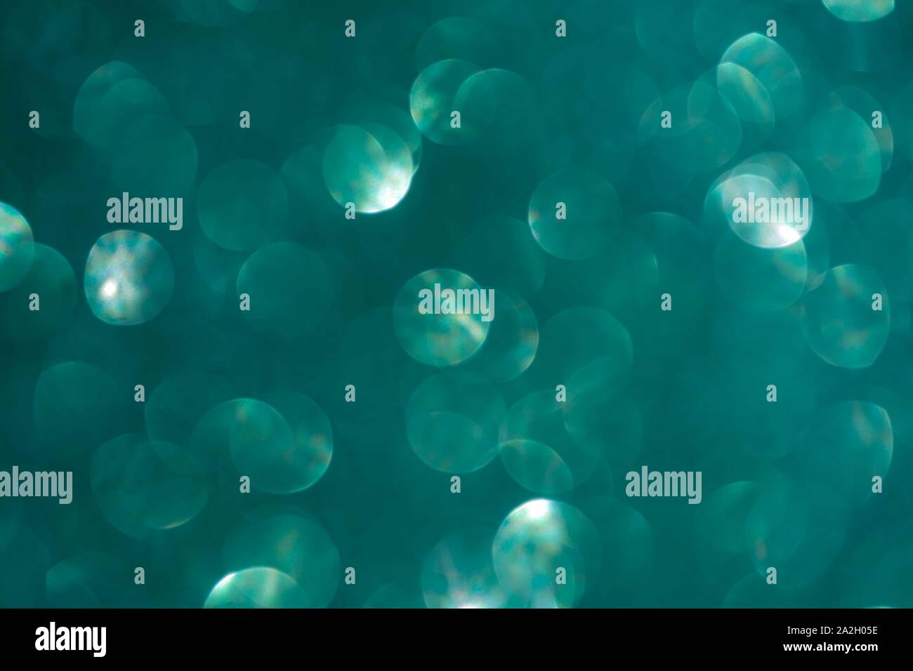 Abstract biscay turquoise green aquamarine defocused bokeh glitter sparkle confetti burst
