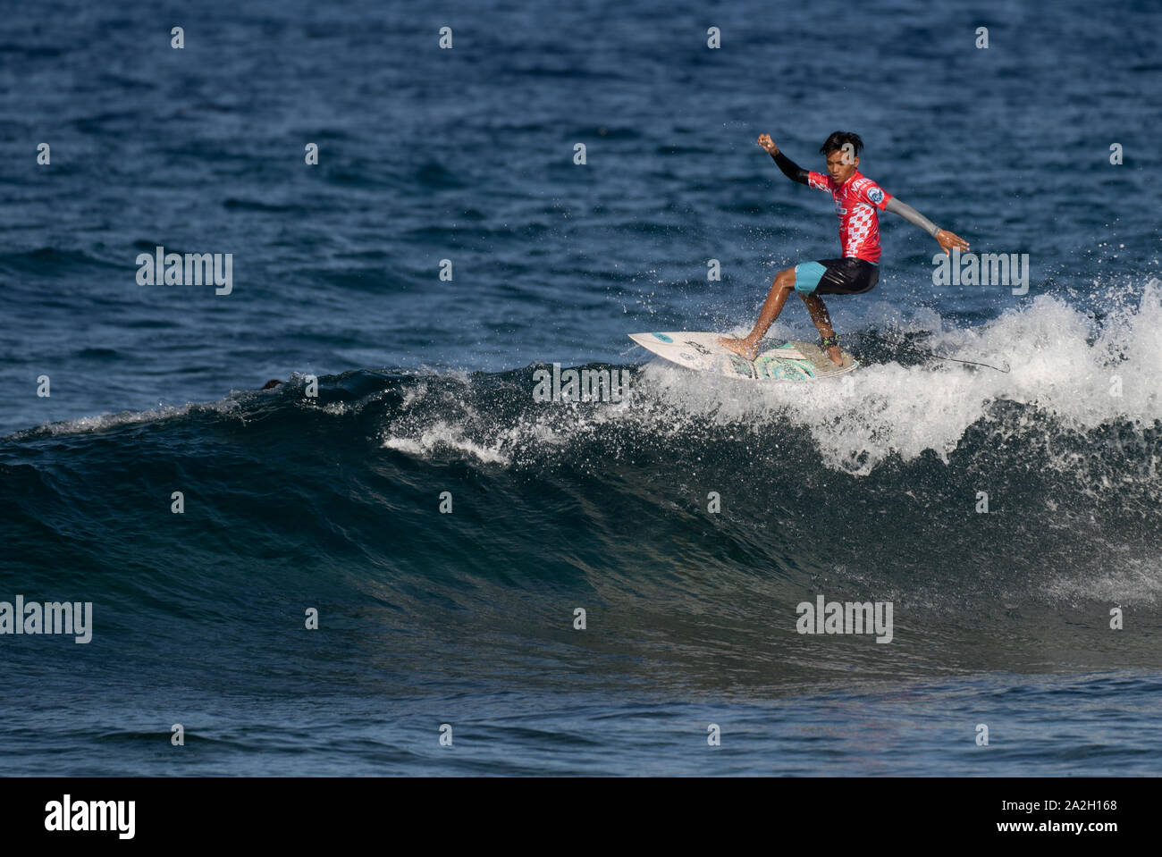 A surfer taking part in the Philippine National surfing Championships at Cloud 9,Siargao,Philippines Stock Photo