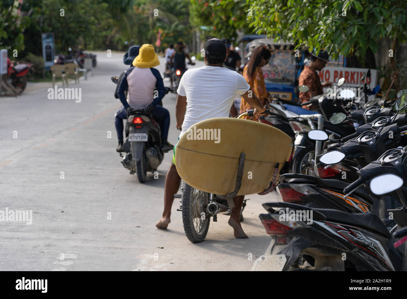 A motorcycle adapted to carry surfboards near to Cloud 9,Siargao