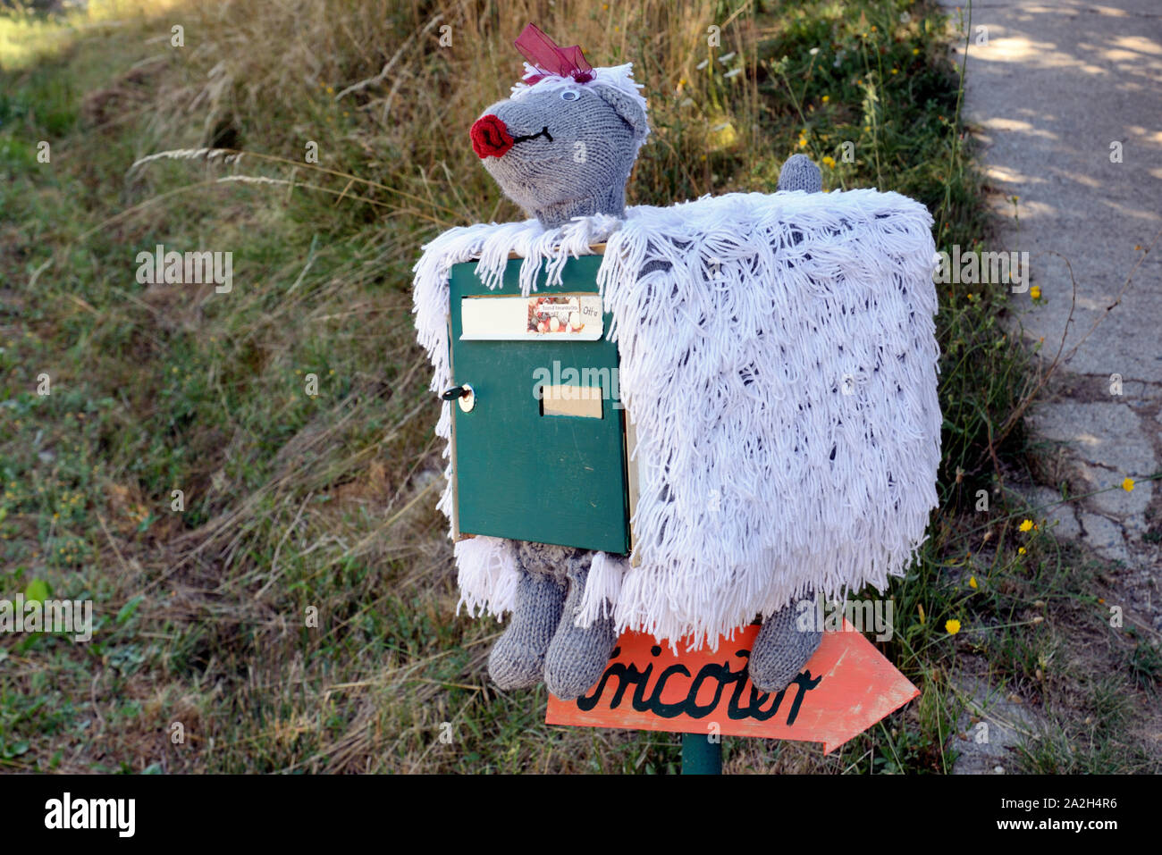 Funny Post Box, Letter Box or Mail Box Decorated or Disguised as Woollen Sheep Stock Photo