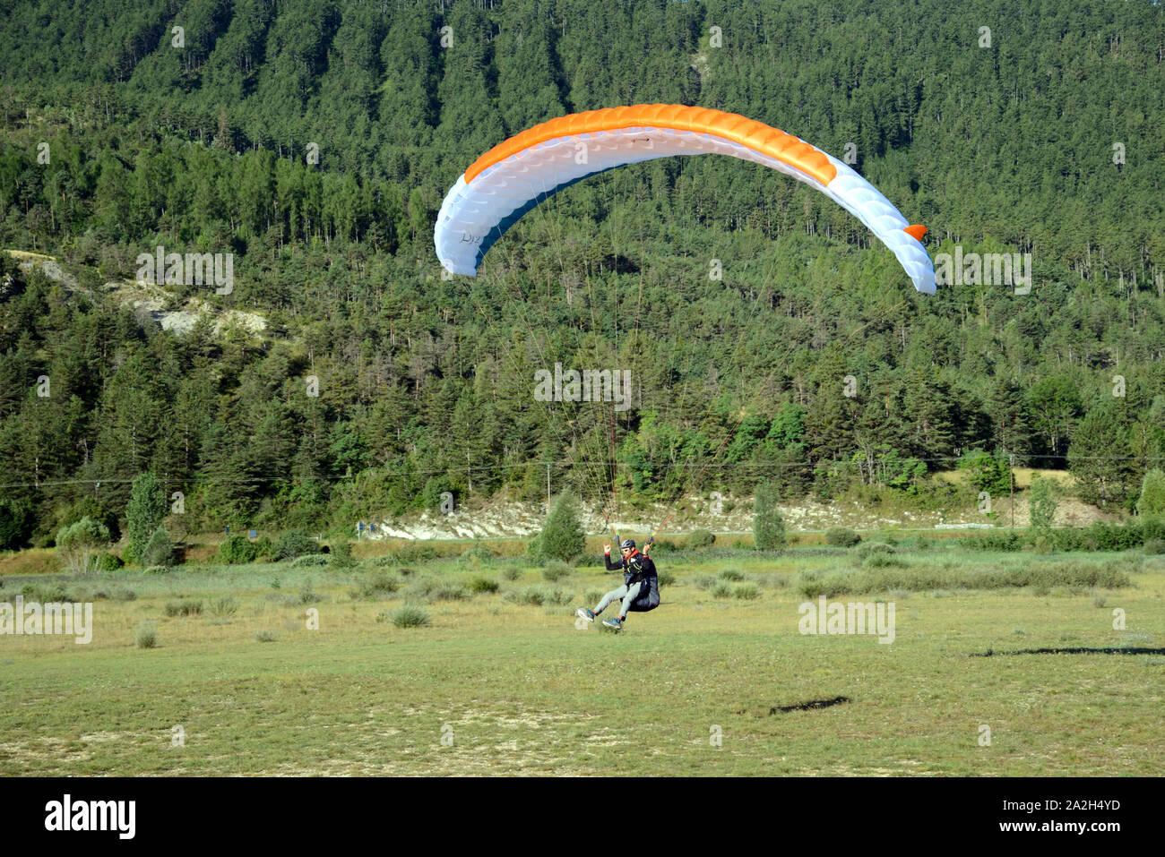 Hang Glider Landing at Saint-André-les-Alpes in the Verdon Regional Park Alpes-de-Haute-Provence Provence france Stock Photo