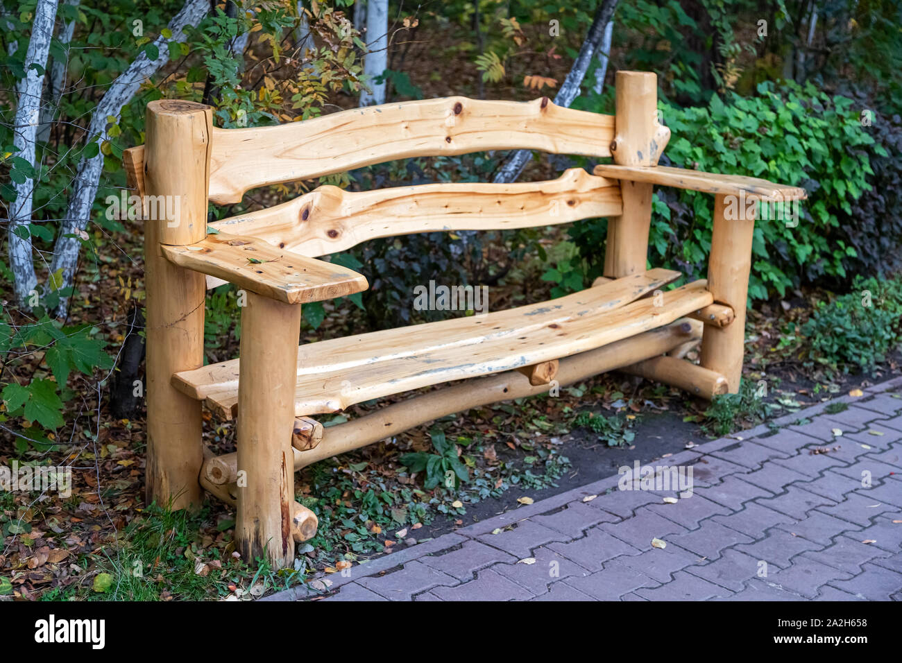 Beautiful New Wooden Bench Made Of Cedar Stands In The Park On A