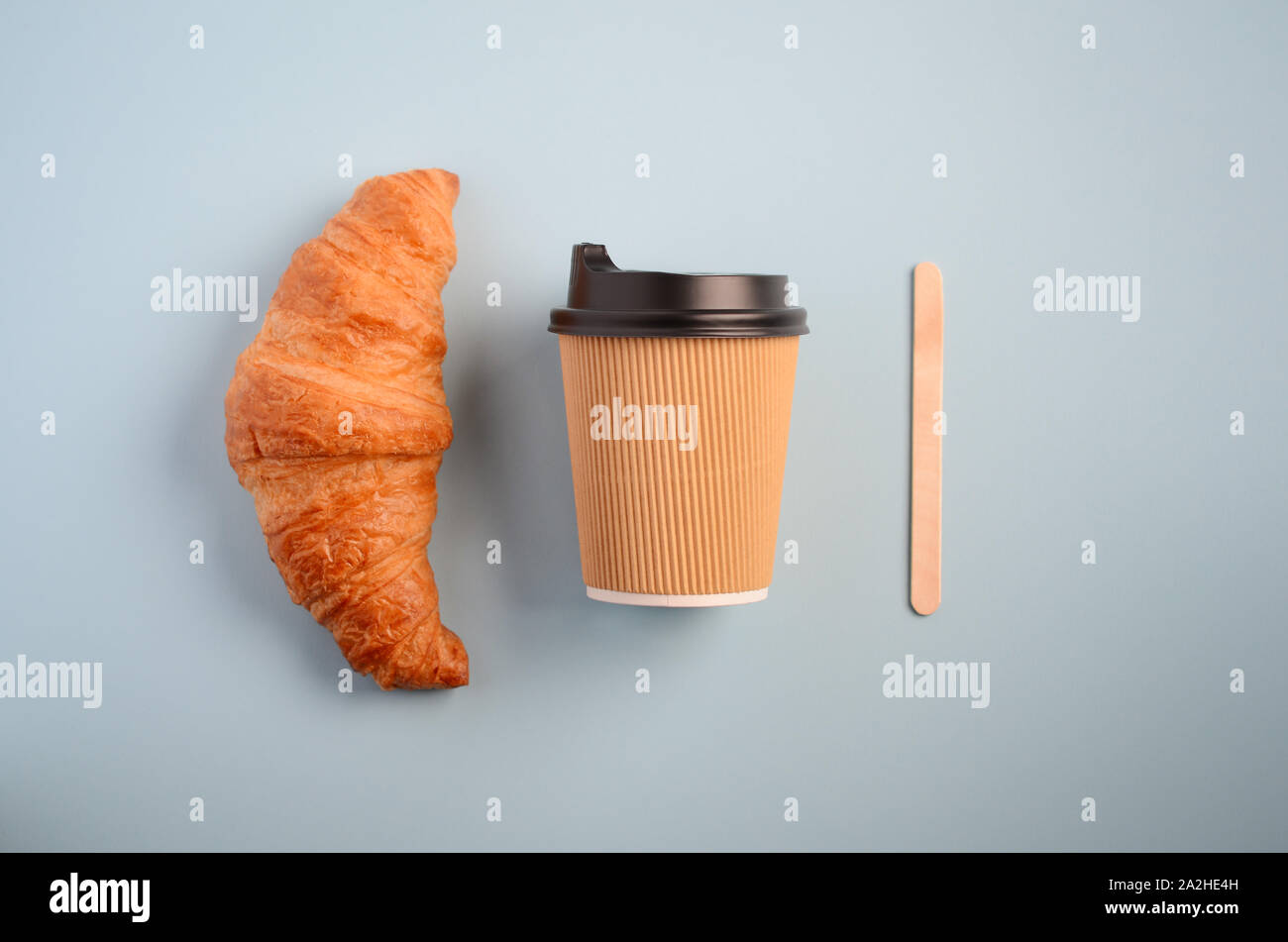 Take away coffee on blue background, top view, flat lay, copy space. Stock Photo