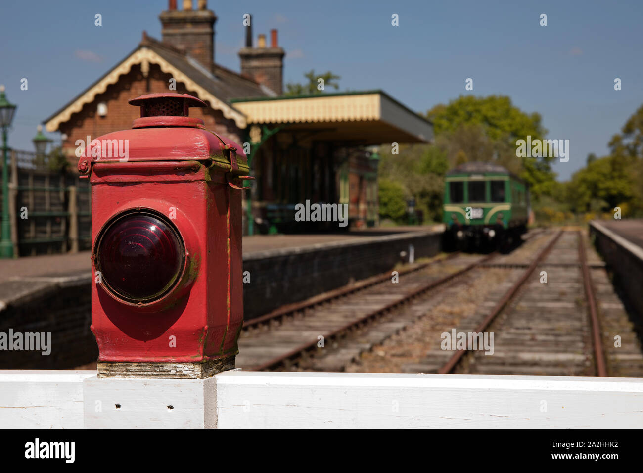 Old signal lamp on railway crossing gate in Norfolk UK Stock Photo