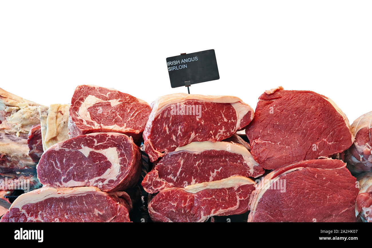 Fridge counter with variety of Irish angus beef meat isolated on white