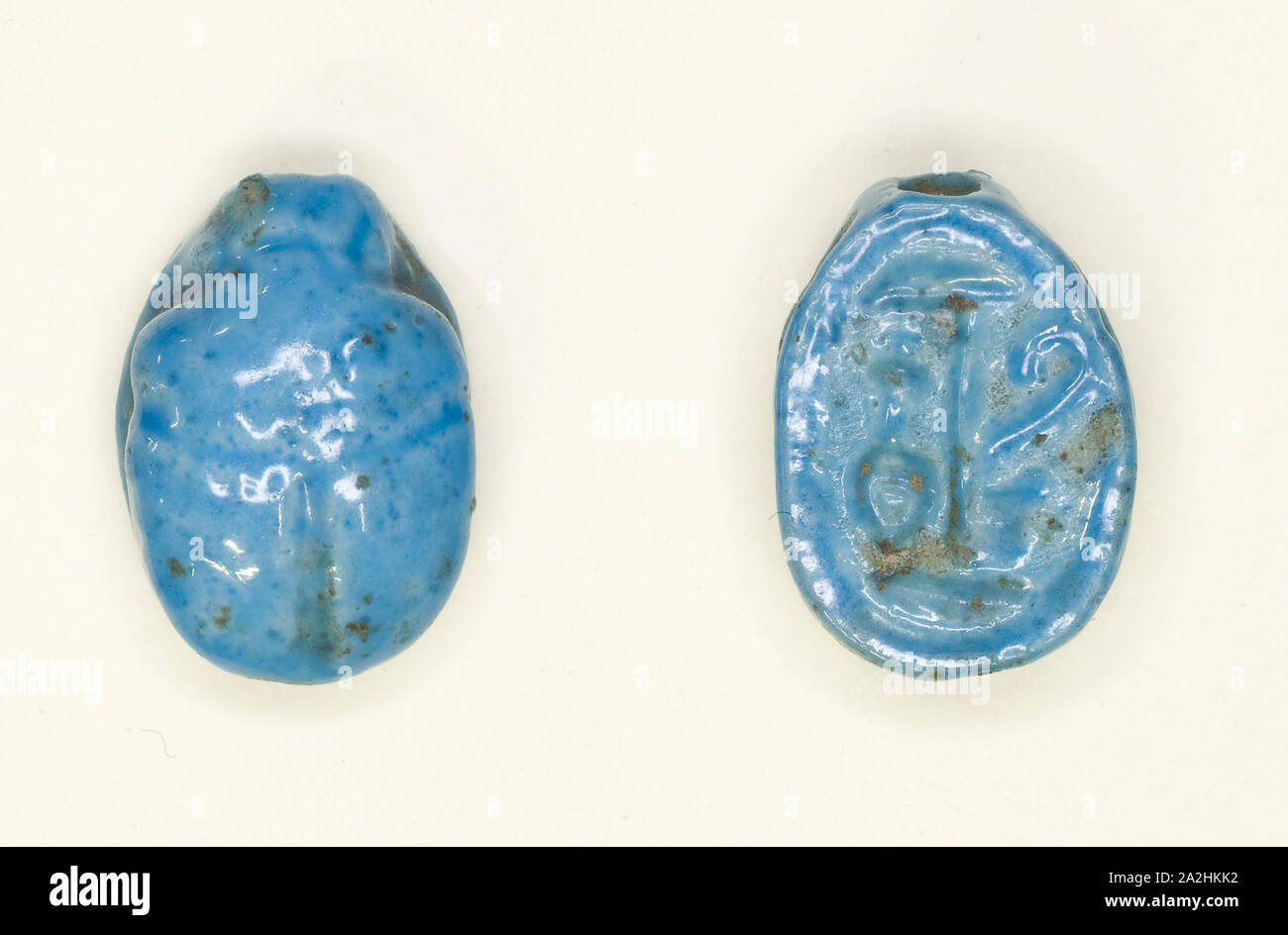 Scarab: Hieroglyphs (Red Crown, nfr- and nb-Signs: Trigramme of Amun), New Kingdom, Dynasties 18–19 (about 1550–1186 BC), Egyptian, Egypt, Faience, 1.3 × 1 × 0.6 cm (1/2 × 3/8 × 1/4 in Stock Photo