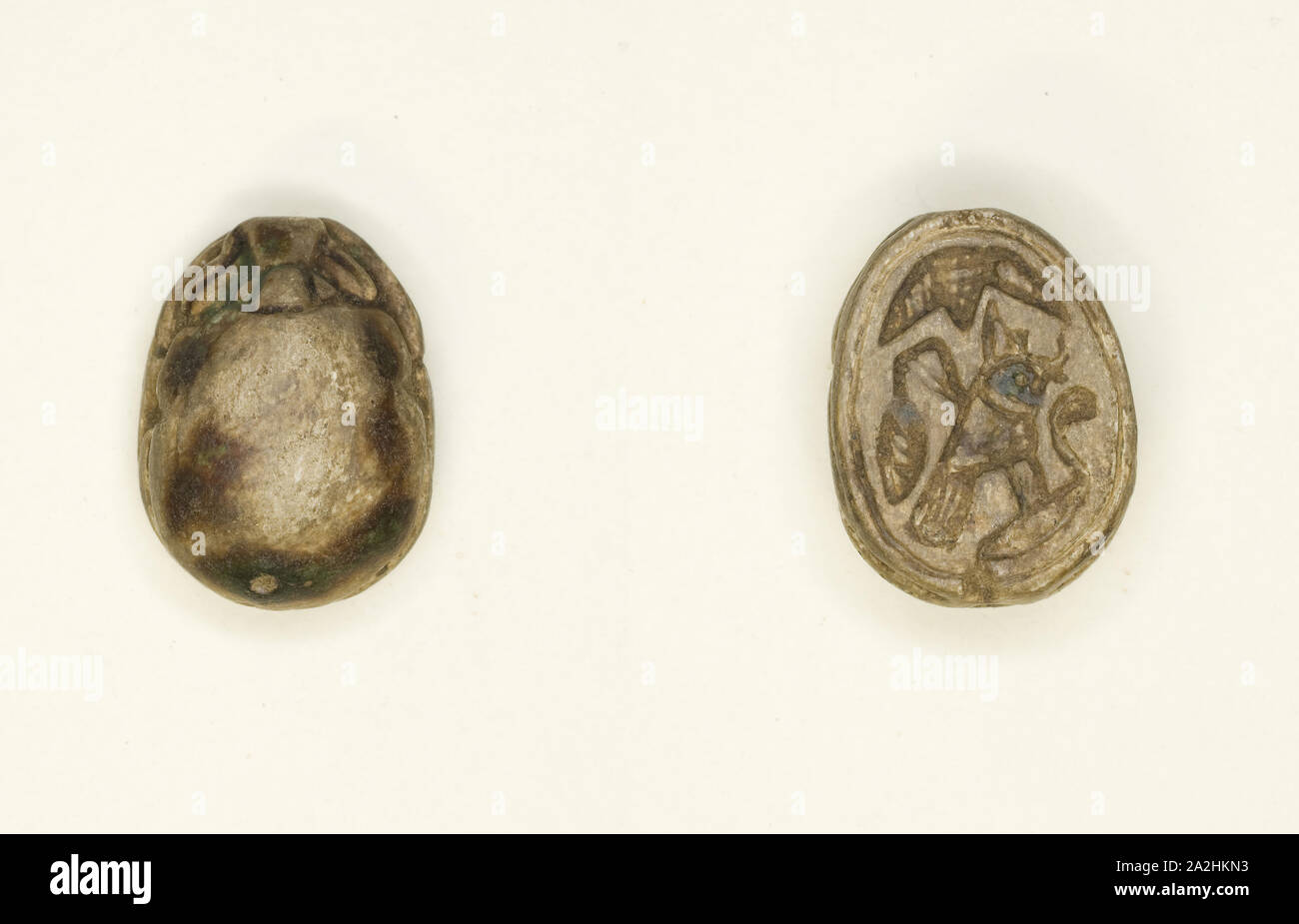 Scarab: Falcon with Red Crown and Cobra (?), New Kingdom, Dynasties 18–19 (?) (about 1550–1186 BC), Egyptian, Egypt, Glazed steatite, 1.6 × 1.3 × 0.6 cm (5/8 × 1/2 × 1/4 in Stock Photo