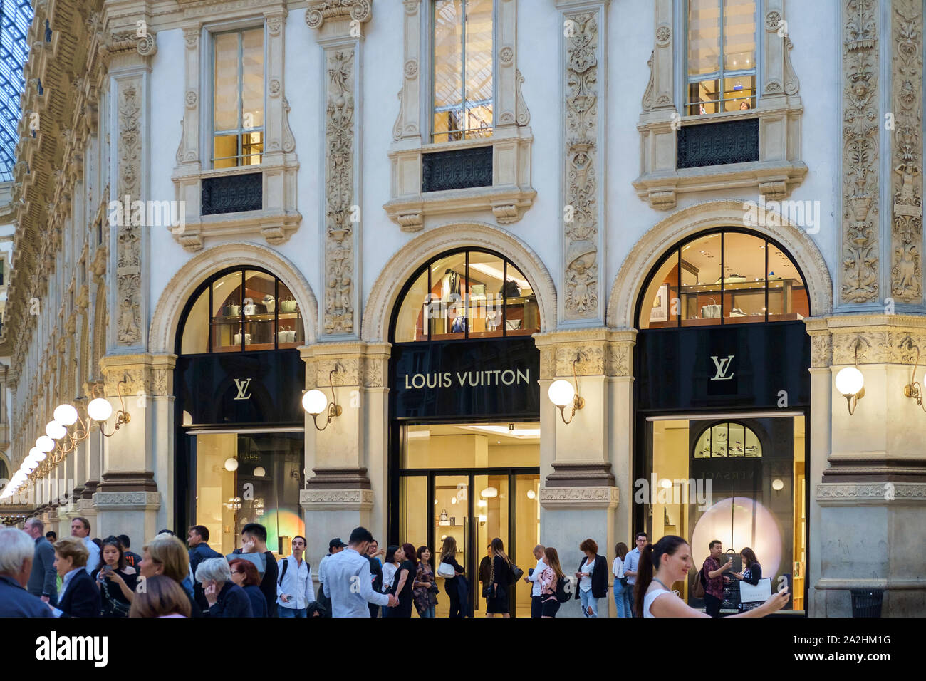 Milan, Italy August 2019. Galleria Vittorio Emanuele near Duomo, group of  tourists standing in front of Louis Vuitton taking pictures Stock Photo -  Alamy