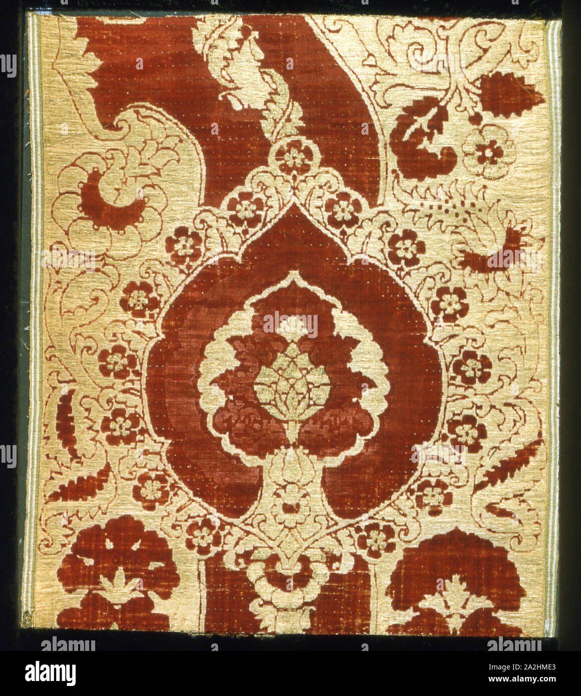 Panel, 1450/1500, Italy, Silk, plain weave variation with supplementary gilt-metal-strip wrapped silk facing wefts forming weft loops in areas and with supplementary pile warps forming cut, pile-on-pile, voided velvet, 70.5 × 60.6 cm (27 3/4 × 23 7/8 in Stock Photo