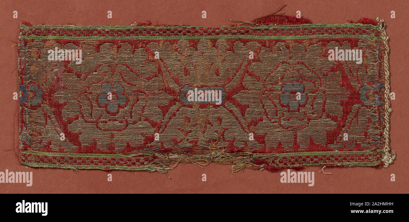 Border, 15th century, Italy, Silk, gold gilt strip wound around linen fiber core, warp-float faced satin weave with supplementary patterning wefts tied by supplementary binding warps in twill interlacing, 11.6 × 27.1 cm (4 1/2 × 10 5/8 in Stock Photo