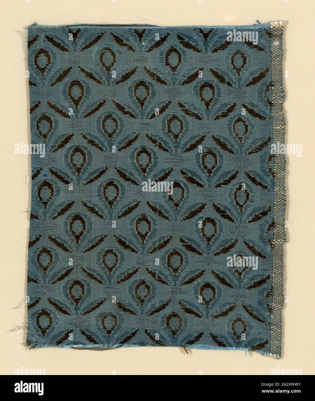 Fragment, 1775/1800, Spain, Silk and silvered-metal strip, warp-faced weft-ribbed plain weave with supplementary patterning wefts, 14 x 10.6 cm (5 1/2 x 4 3/16 in Stock Photo
