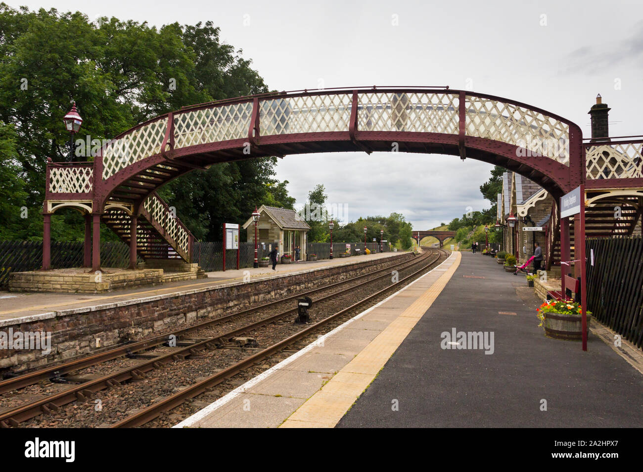The railway station at Kirkby Stephen in Cumbria on a dull, cloudy day, looking in the northbound direction. Stock Photo