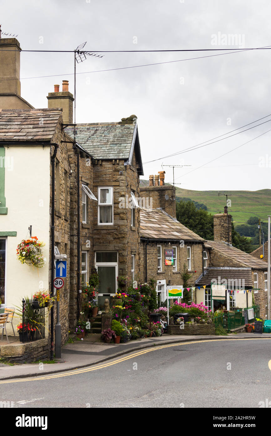 The Holme, Hawes,  North Yorkshire. PArt of the A684 through the small market town of Hawes, looking down from Market Place. Stock Photo