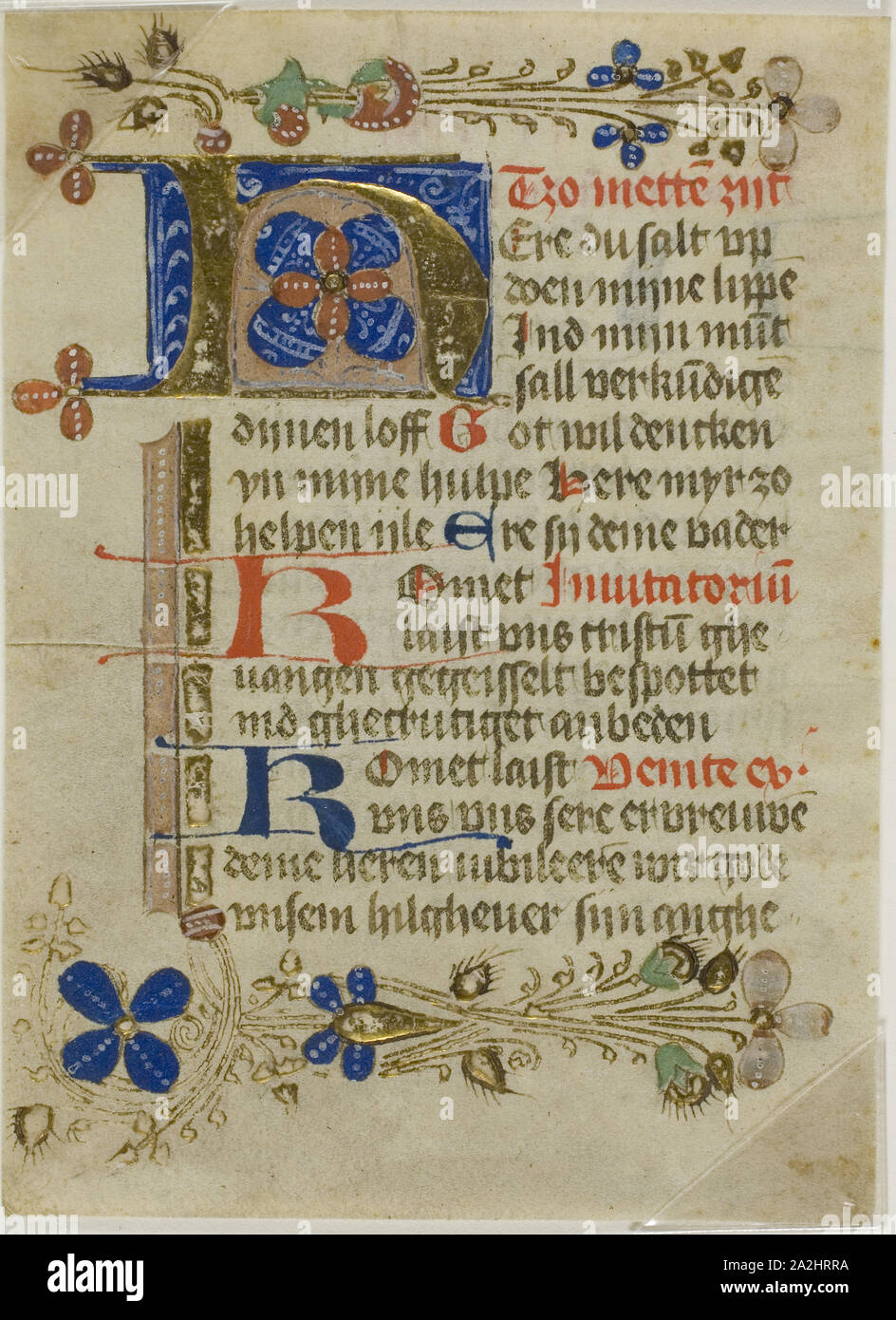 Illuminated Initial H from a Prayerbook, 15th century, Northern German (possibly Munster), Germany, Manuscript cutting in tempera and gold leaf, with Plattdeutsch inscriptions in light brown, red and blue inks, on parchment, 120 x 88 mm Stock Photo