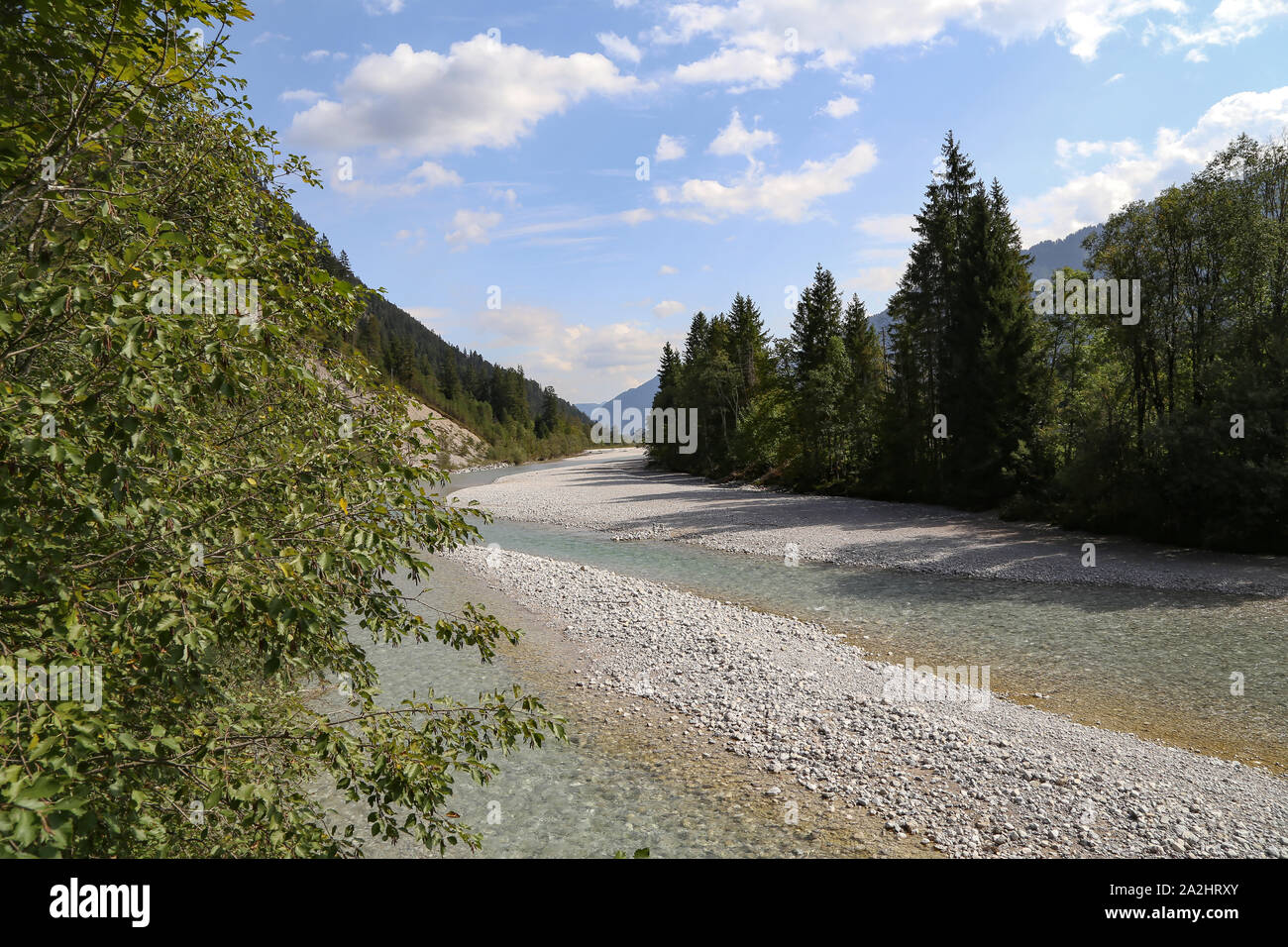 Mountain landscape with a small river in the Alps Stock Photo - Alamy