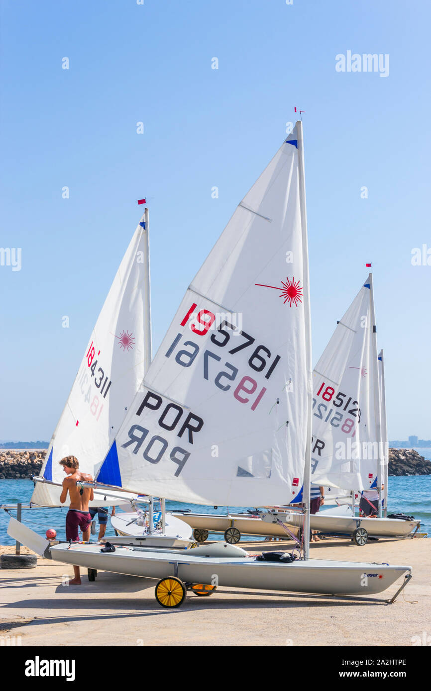 Lagos, Algarve, Portugal.  Small sailing boats next to the Forte da Ponte da Bandeira. Stock Photo