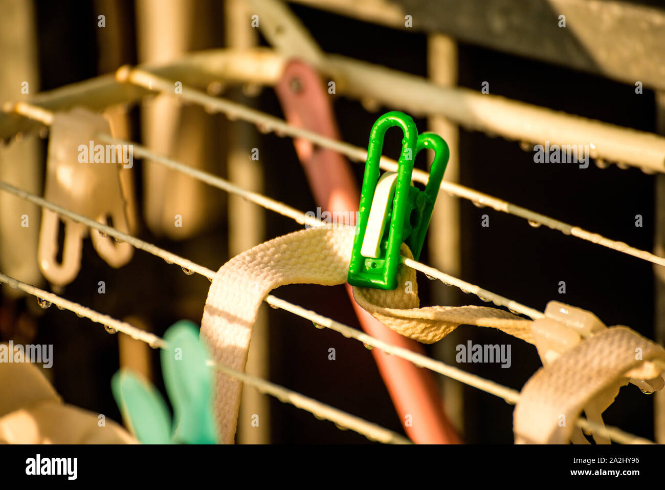 drying rack on a balcony with raindrops Stock Photo
