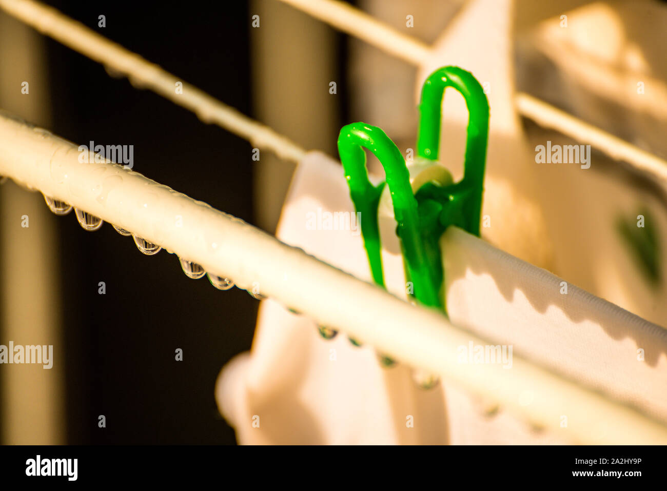 drying rack on a balcony with raindrops Stock Photo