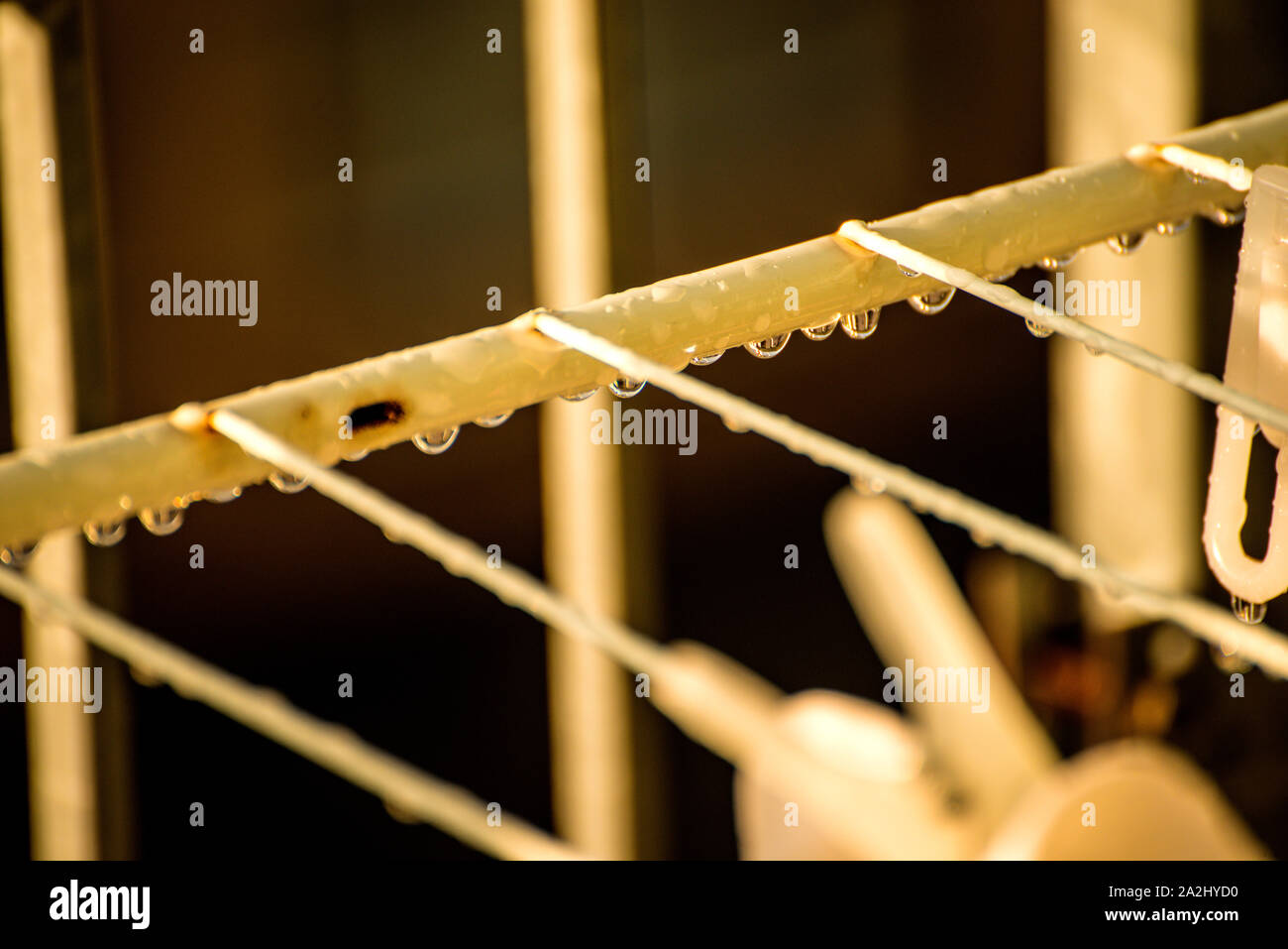 drying rack on a balcony with raindrops Stock Photo