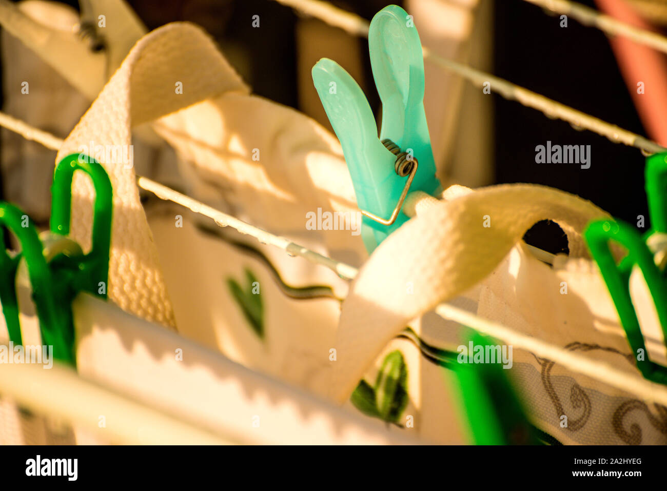 drying rack on a balcony with raindrops Stock Photo