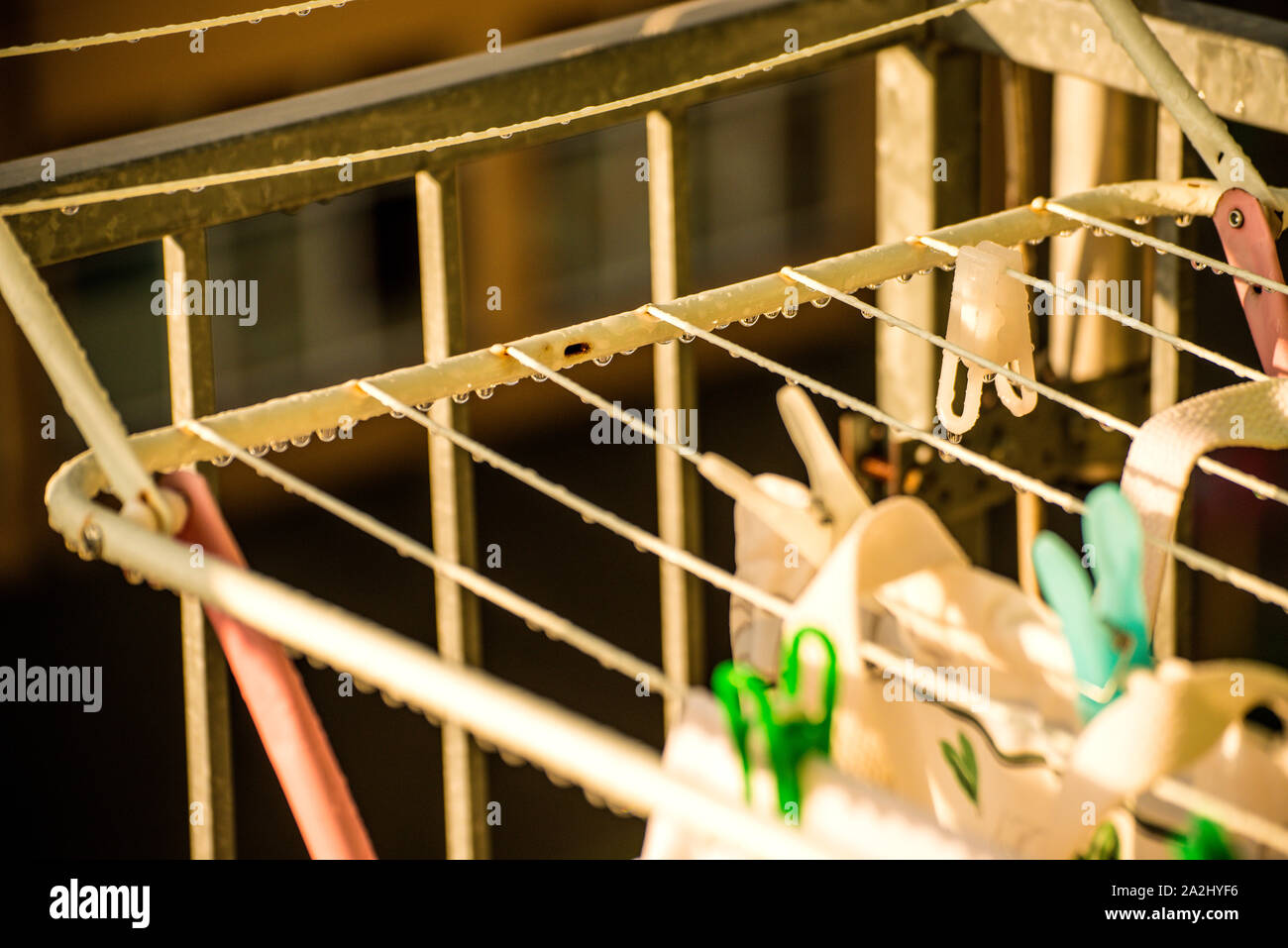 drying rack on a balcony with raindrops Stock Photo