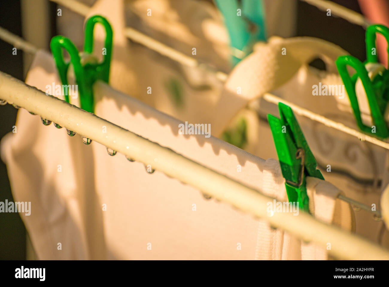 drying rack on a balcony with raindrops Stock Photo
