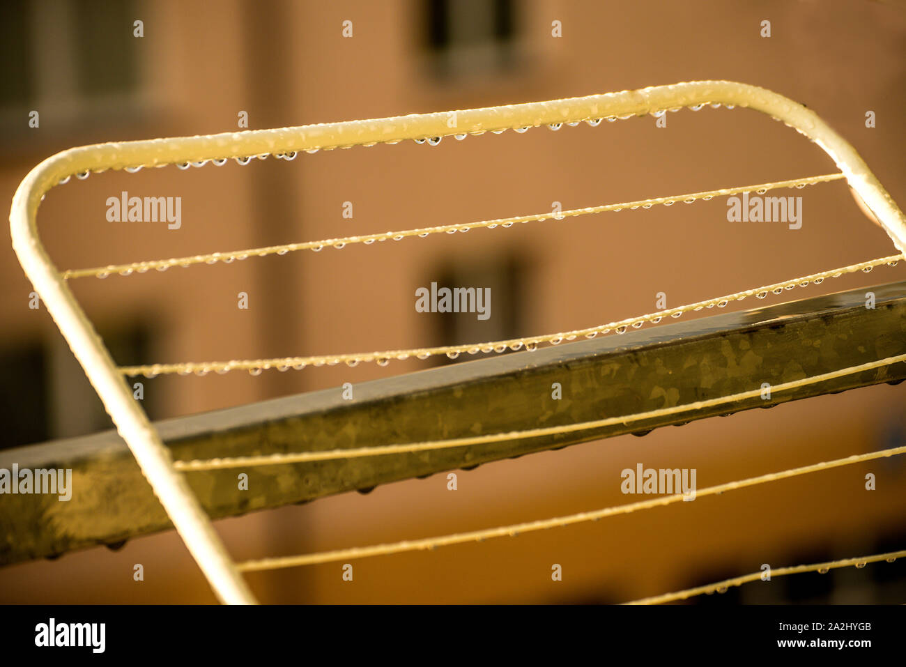 drying rack on a balcony with raindrops Stock Photo