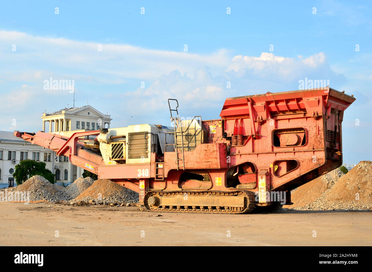 https://c8.alamy.com/comp/2A2HYM8/mobile-stone-crusher-machine-by-the-construction-site-or-mining-quarry-for-crushing-old-concrete-slabs-into-gravel-and-subsequent-cement-production-2A2HYM8.jpg