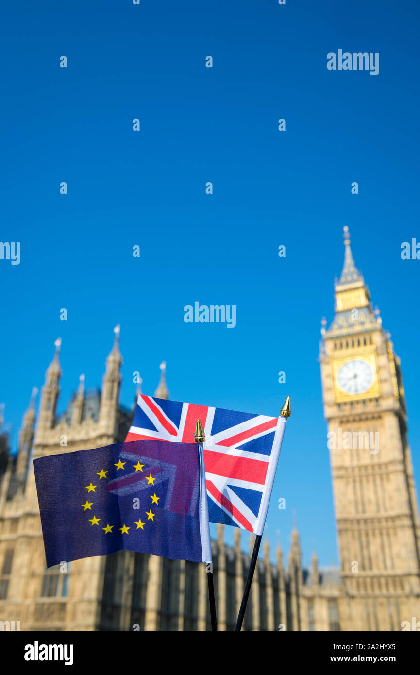 European Union and British Union Jack flag flying together for Brexit in front of Big Ben and the Houses of Parliament at Westminster Palace, London Stock Photo