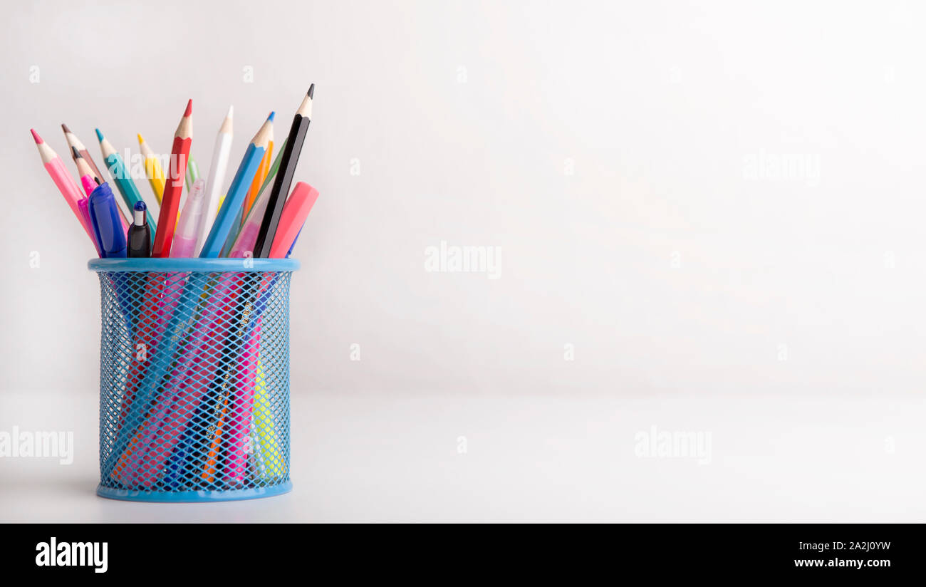 Box with colored pencils isolated on white background Stock Photo
